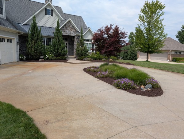 Front yard landscaping with flower beds