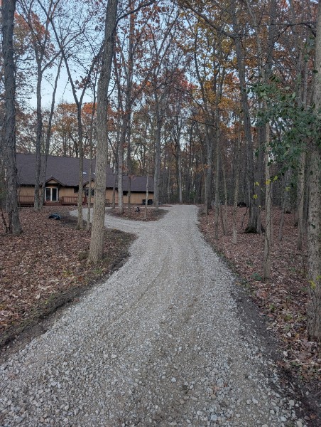 Gravel driveway through fall foliage