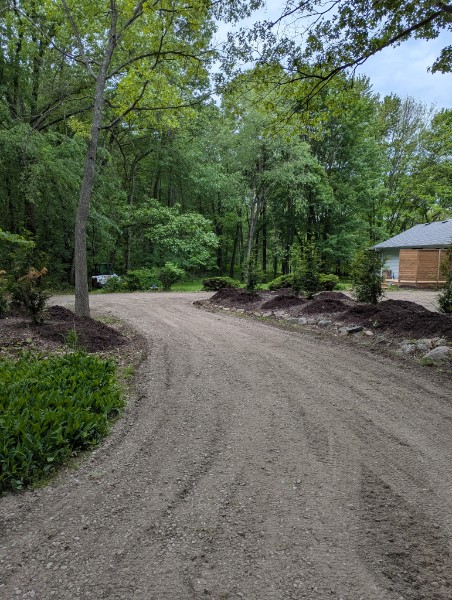 Gravel driveway with landscaped edges