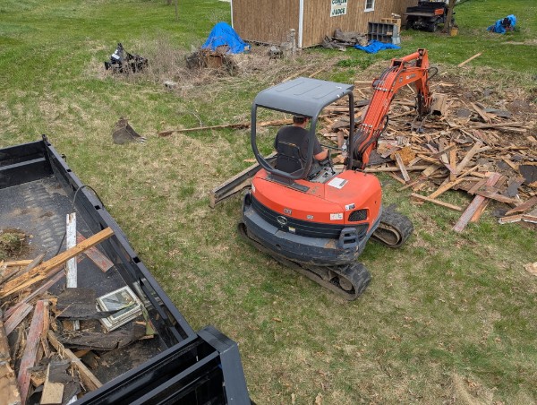 Mini excavator land clearing